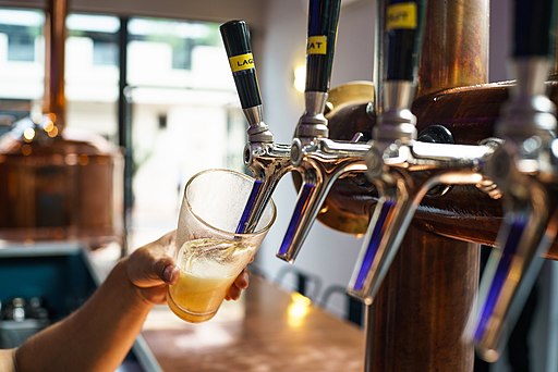 pouring a beer from a tap