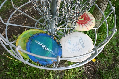 disc golf discs in a basket