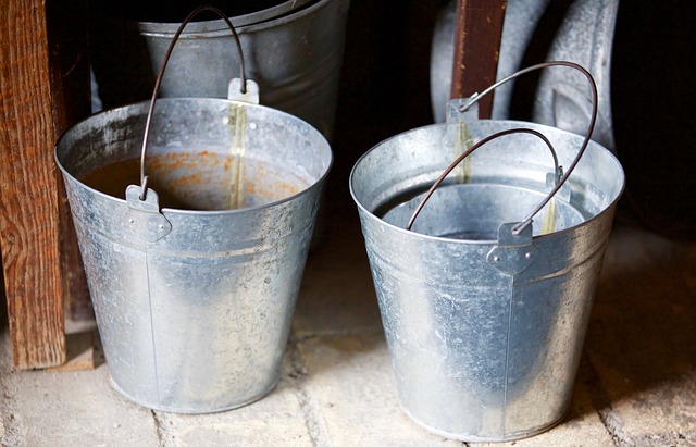 assortment of steel farm buckets