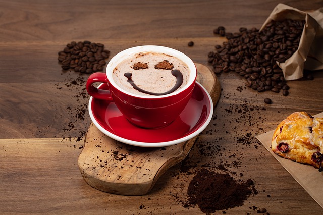 cup of mocha with beans and smiley face in foam