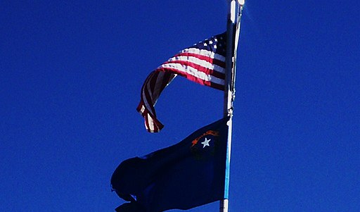 U.S. flag and Nevada flag waving
